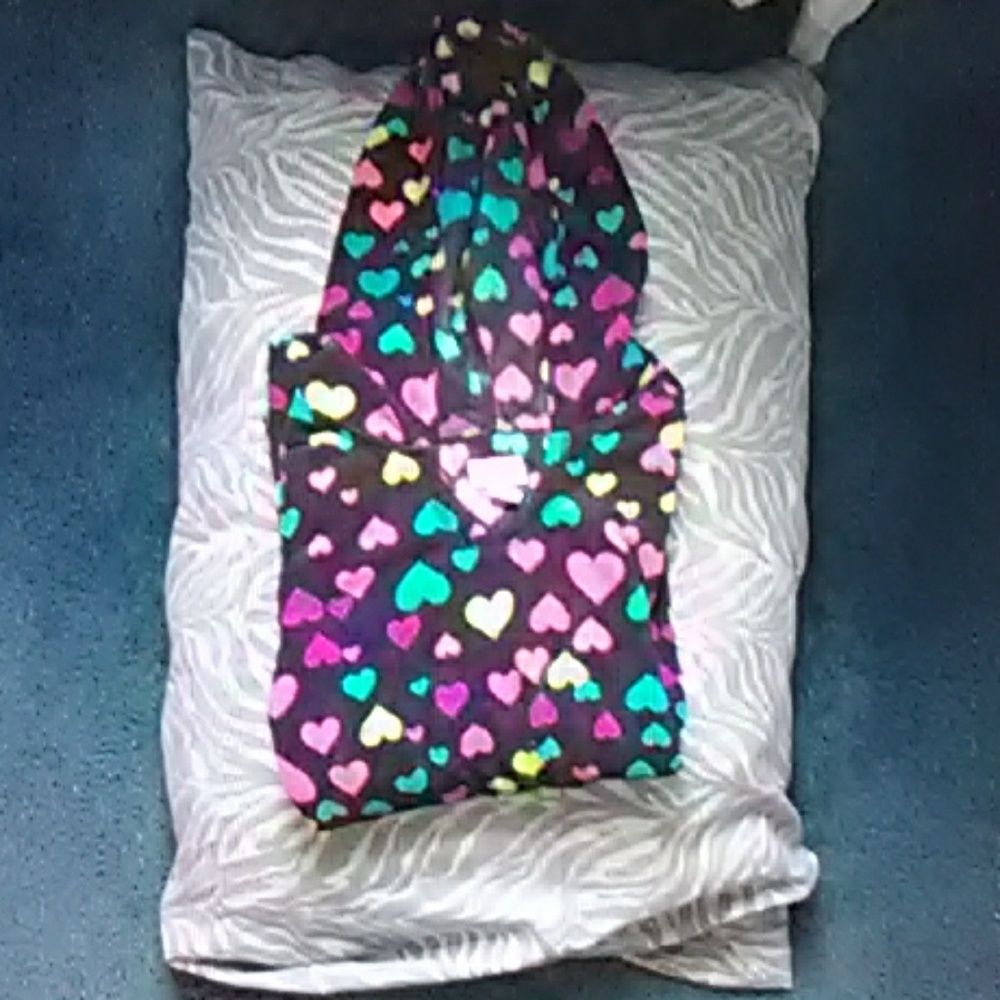 A multicolored heart sweater